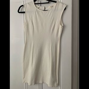 Charming sleeveless cream sheath dress.